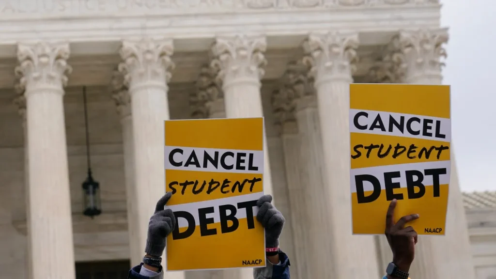 Student debt relief advocates gather outside the Supreme Court on Capitol Hill